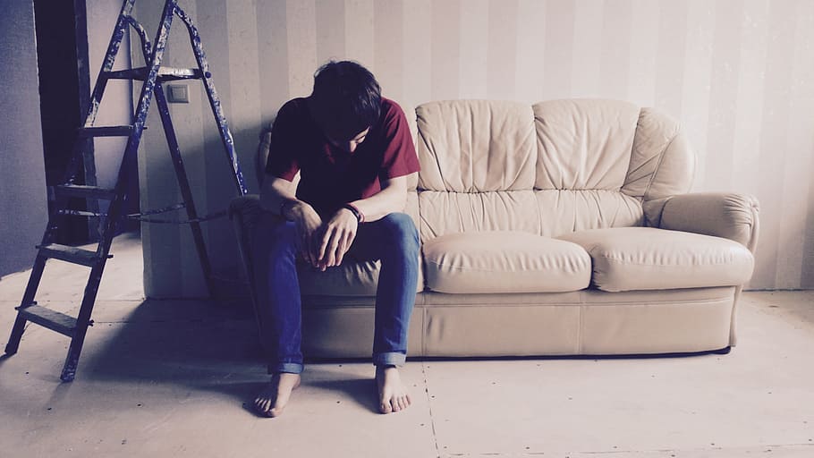 man sitting on brown couch beside black A-type ladder, Emotions HD wallpaper