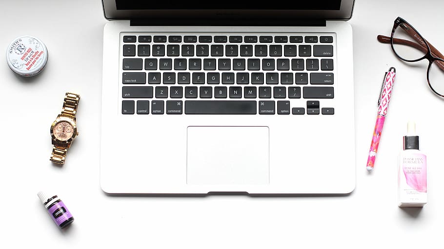 MacBook Pro near pen, MacBook Pro near round gold-colored watch, HD wallpaper