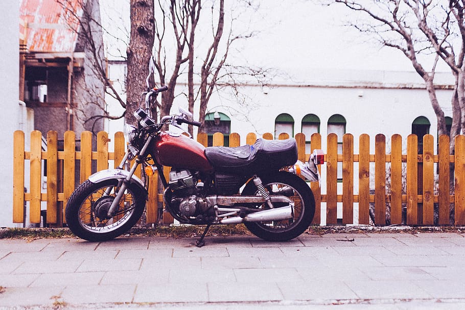 red cruiser motorcycle parked beside wooden fence, Chopper, Motorbike
