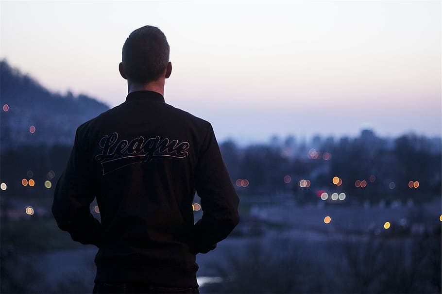 man in black League jacket standing, guy, people, looking, men HD wallpaper