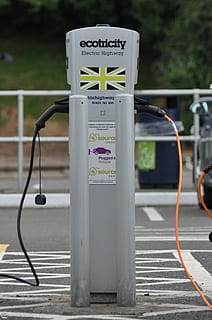 selective focus photography of gray Ecotricity electric highway on black asphalt road HD wallpaper