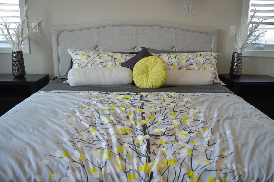 white and yellow bed sheet and pillow cases, pillows, bedroom