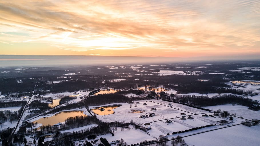 aerial photography of snow covered area under white cloudy skies golden hour photography, aerial photography of snow covered town HD wallpaper