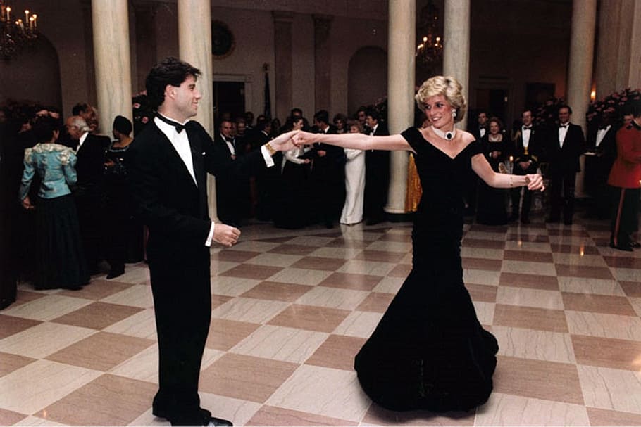 man and woman about to dance inside brown and white room, princess diana