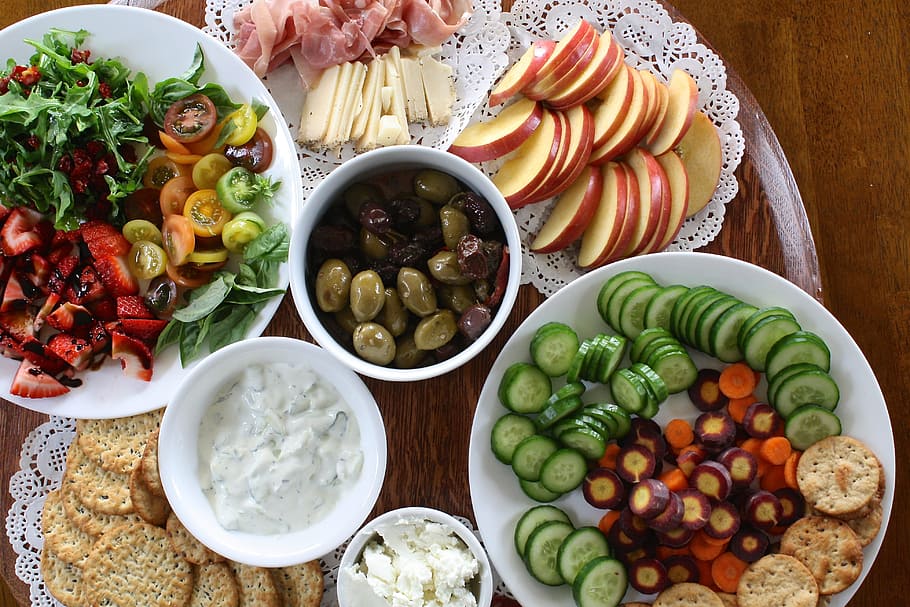 sliced assorted fruits and vegetables on the table, appetizer