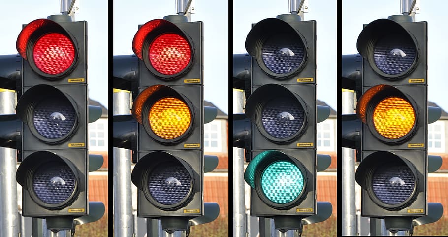 four turned-on traffic lights, signal, street, road, safety, stoplight