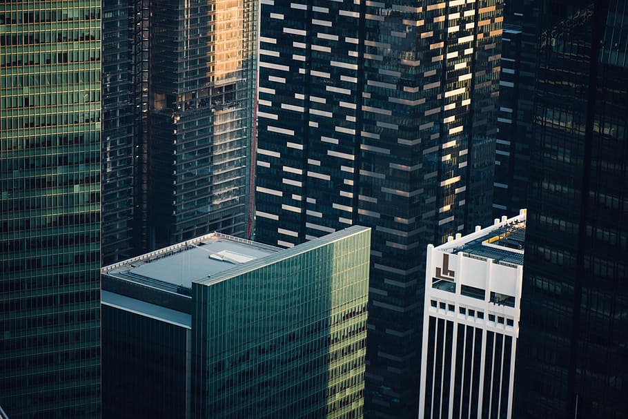 gray concrete buildings, aerial photography of commercial building HD wallpaper