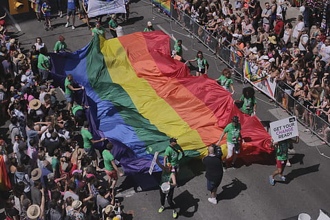 people holding multicolored textile, Pride, Flag, Pride Flag HD wallpaper