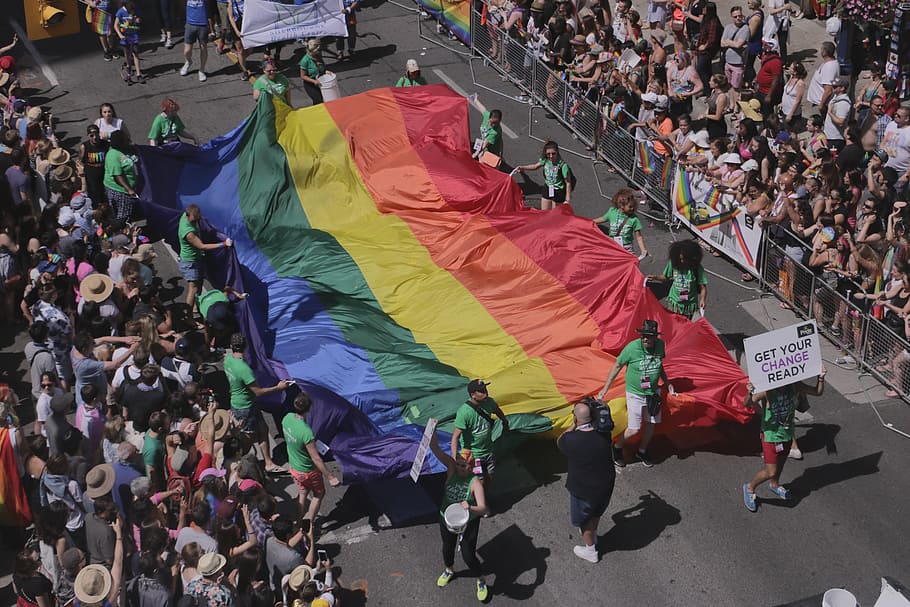 people holding multicolored textile, Pride, Flag, Pride Flag HD wallpaper