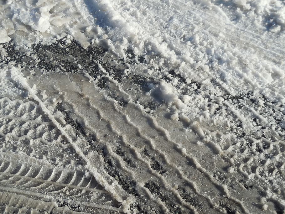 aerial view of snow field, tire tracks, road, truck, transportation