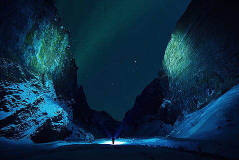 person between mountains, ice, cave, rocks, snow, winter, flashlights HD wallpaper