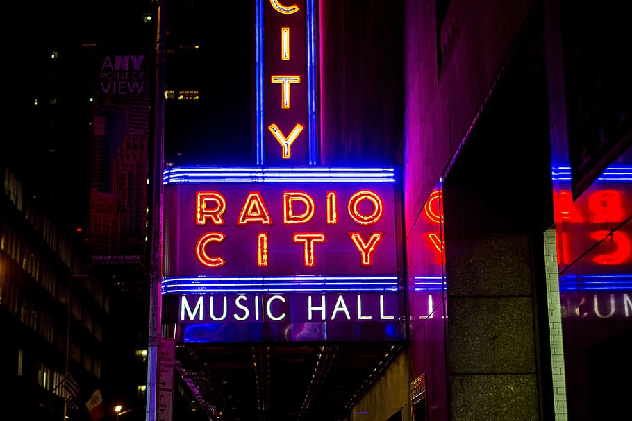 Radio City Music Hall street LED signage, minimalist photography of Radio City music hall neon light signage