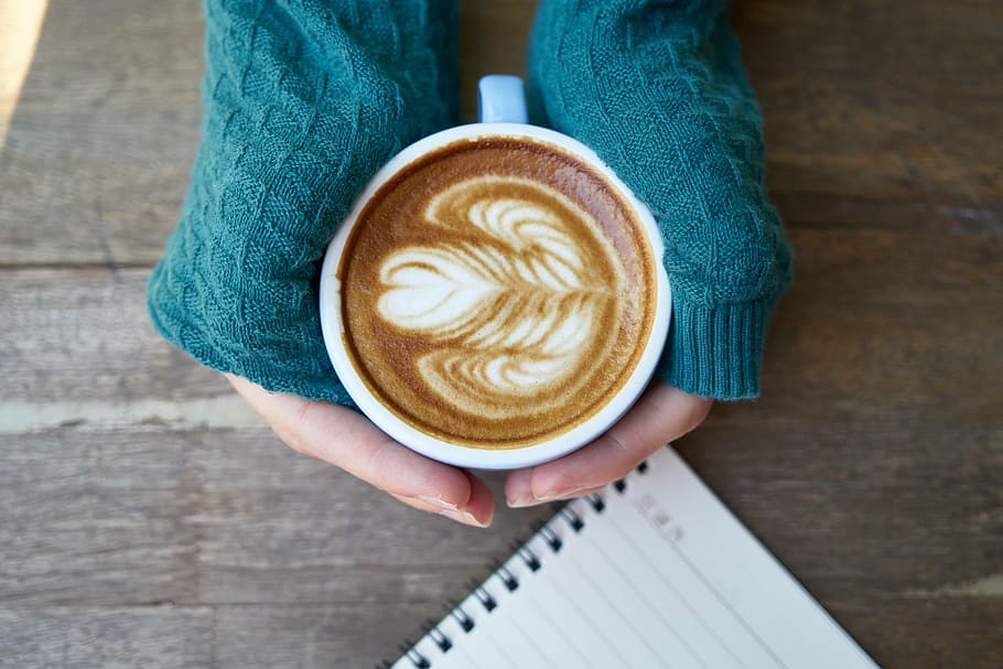 person holding cup with coffee art, cafe, beverage, coffee cup HD wallpaper