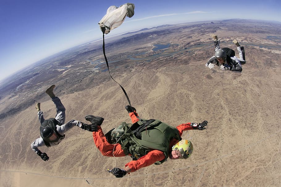 three person floating on sky at daytime, skydive, parachute, parachuting