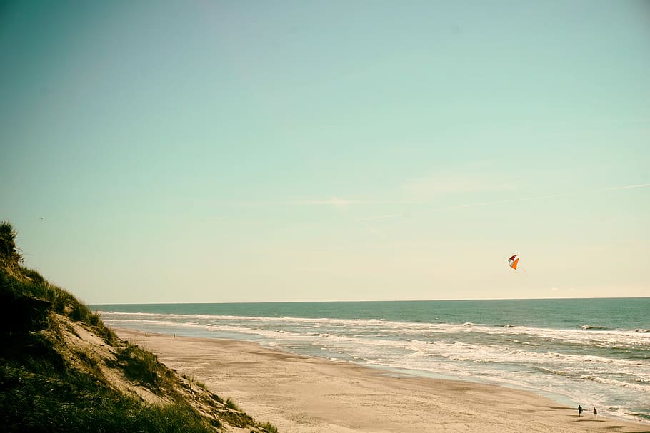 person flying kite on seashore, two person playing kite on seashore HD wallpaper