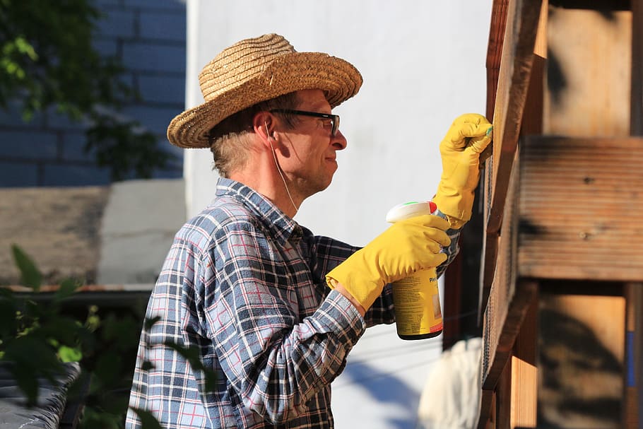 man mending brown wall, dad, repair, work, cleanup, hat, adult HD wallpaper