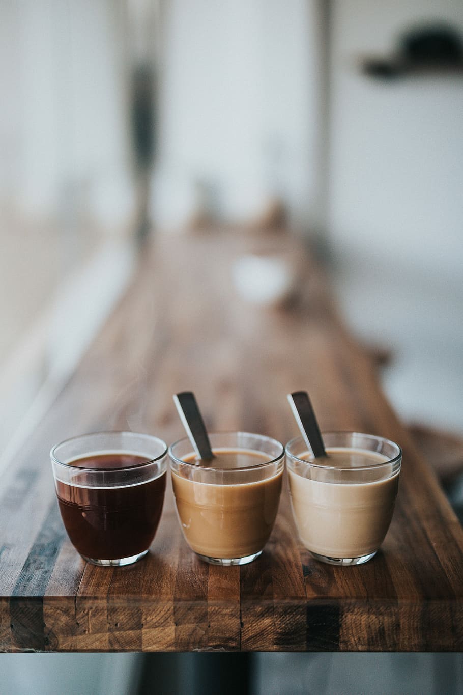 macro photography of three assorted liquids, selective focus photography of three clear cups HD wallpaper