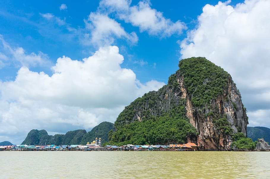 rock isles beside village during daytime panoramic photo, natural HD wallpaper