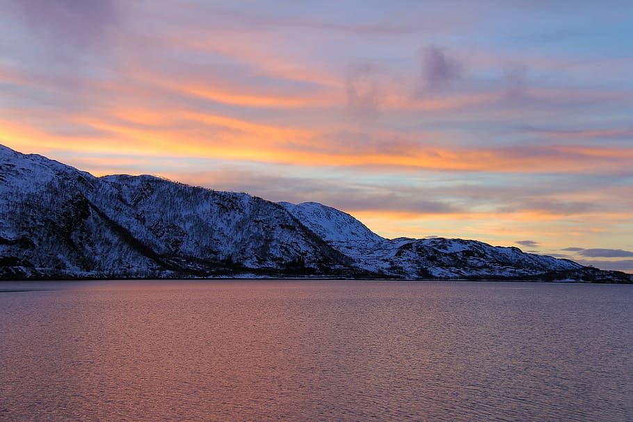 mountain beside body of water during golden hour, sunset, ever-changing HD wallpaper