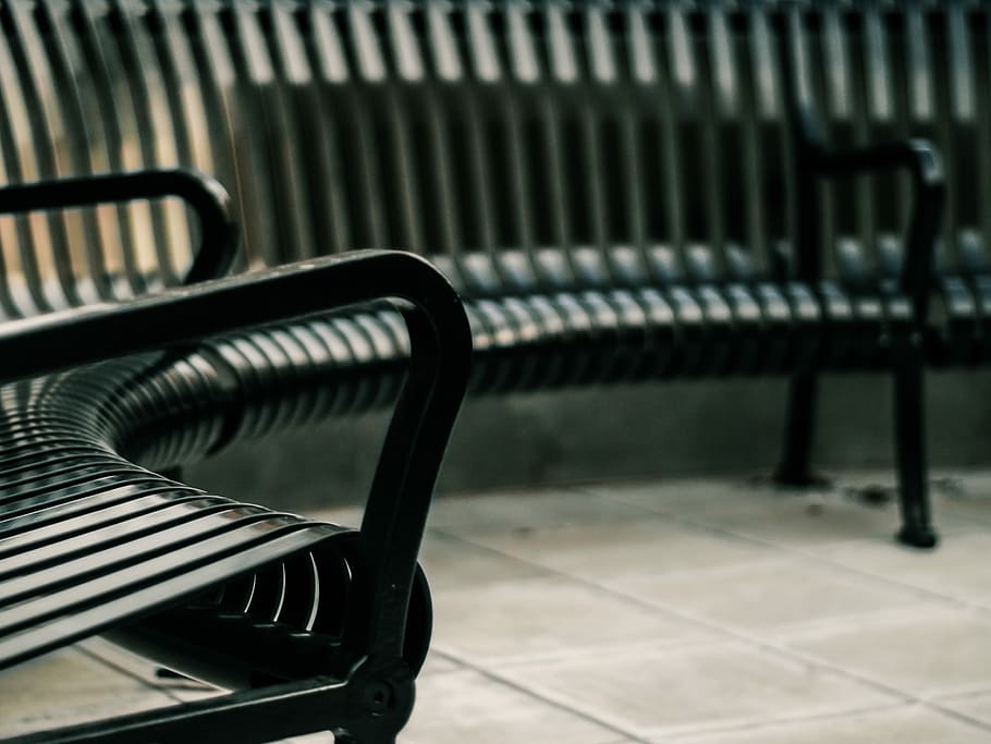 black metal framed bench, selective focus photography of black metal bench HD wallpaper
