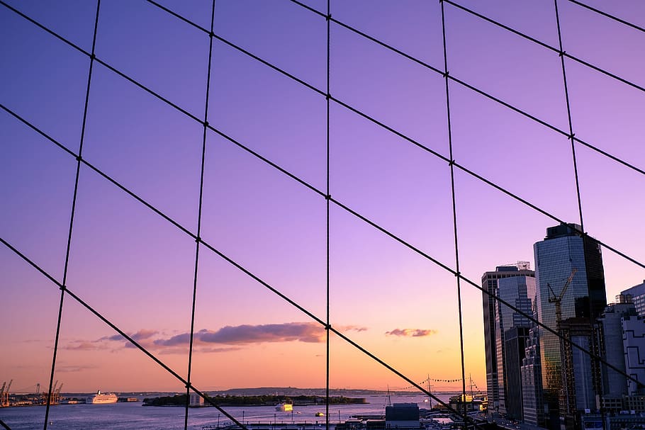 photography of buildings during sunset, gray high rise building near body of water during sunset HD wallpaper
