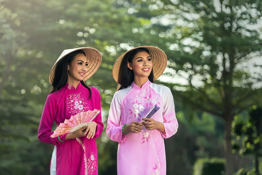 two women in pink cheongsam dresses during daytime, adult, asia