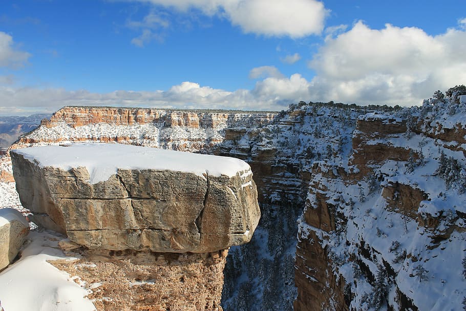landscape photo of cliff covered with snow, grand canyon, winter