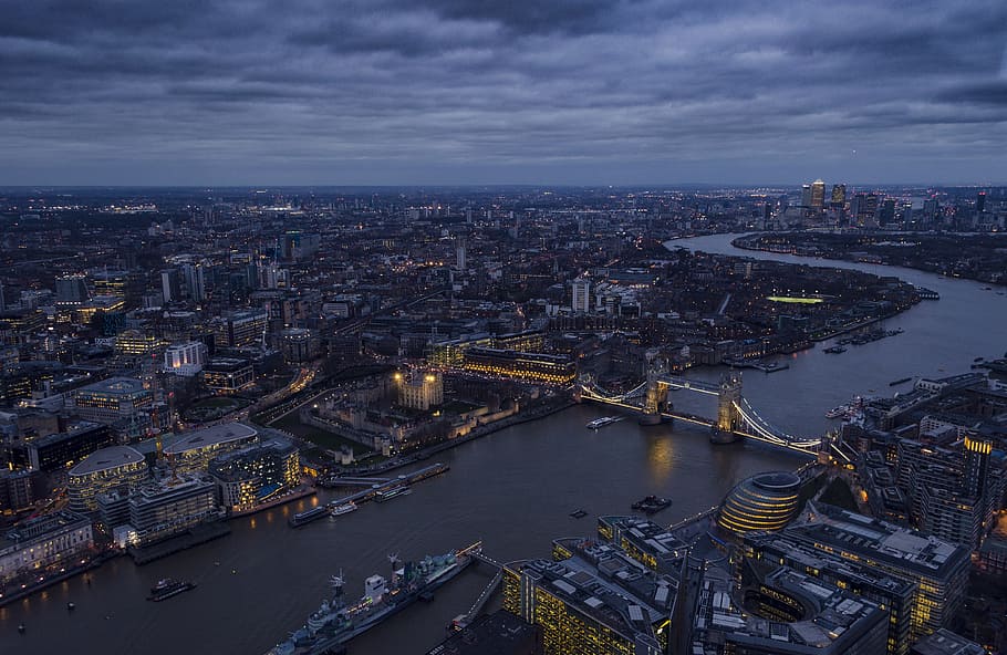 aerial photography of city buildings, cityscape photo under gray clouds HD wallpaper