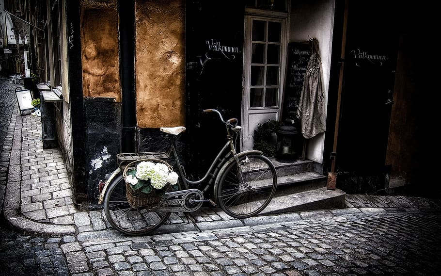 gray commuter bike parked beside black building, Stockholm, Bicycle
