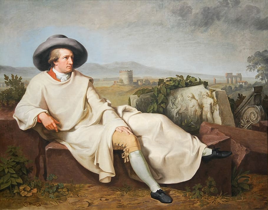 man wearing white top sitting on brown concrete brick painting, HD wallpaper