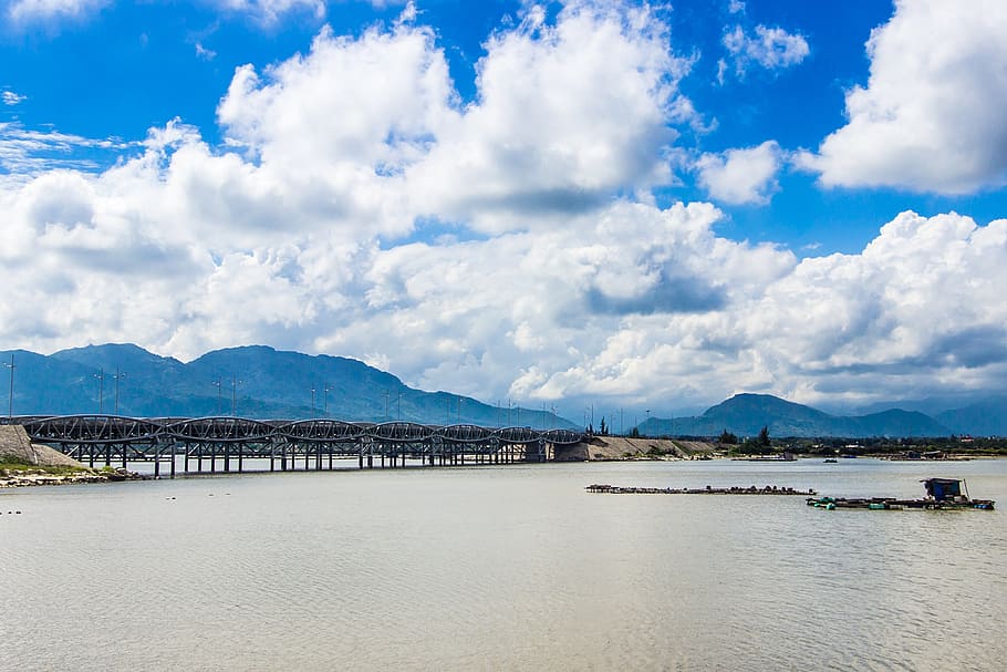 bridge, long, outdoor, oranges, write, male, cloud - sky, mountain HD wallpaper