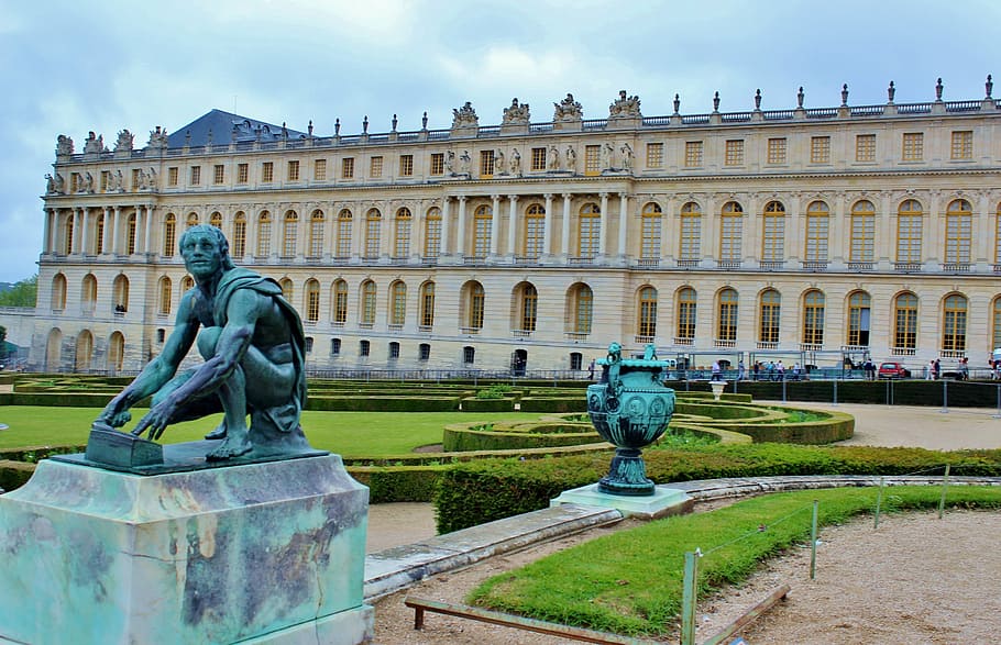 statue of man crouching during daytime, paris, france, versailles