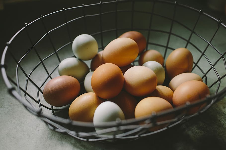 brown and white eggs on gray basket, eggs in silver metal basket HD wallpaper