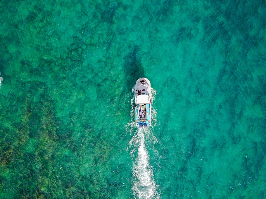 aerial photo of white boat sailing on body of water at daytime, bird's eye view of yacht on body of water HD wallpaper