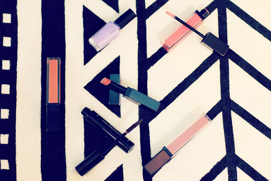 makeup product lot on top of white and black wooden surface, direction HD wallpaper