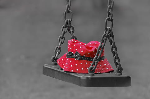 red and white polka dot bucket hat placed on metal swing, forgotten HD wallpaper