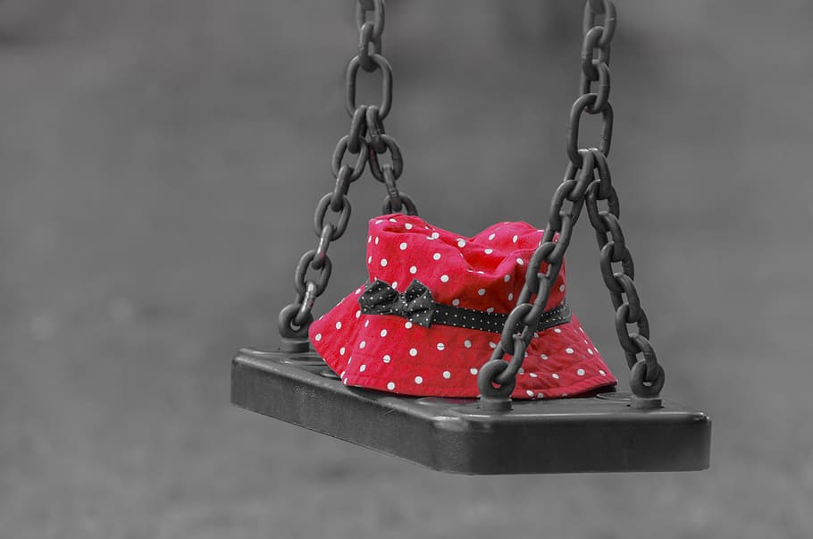 red and white polka dot bucket hat placed on metal swing, forgotten HD wallpaper