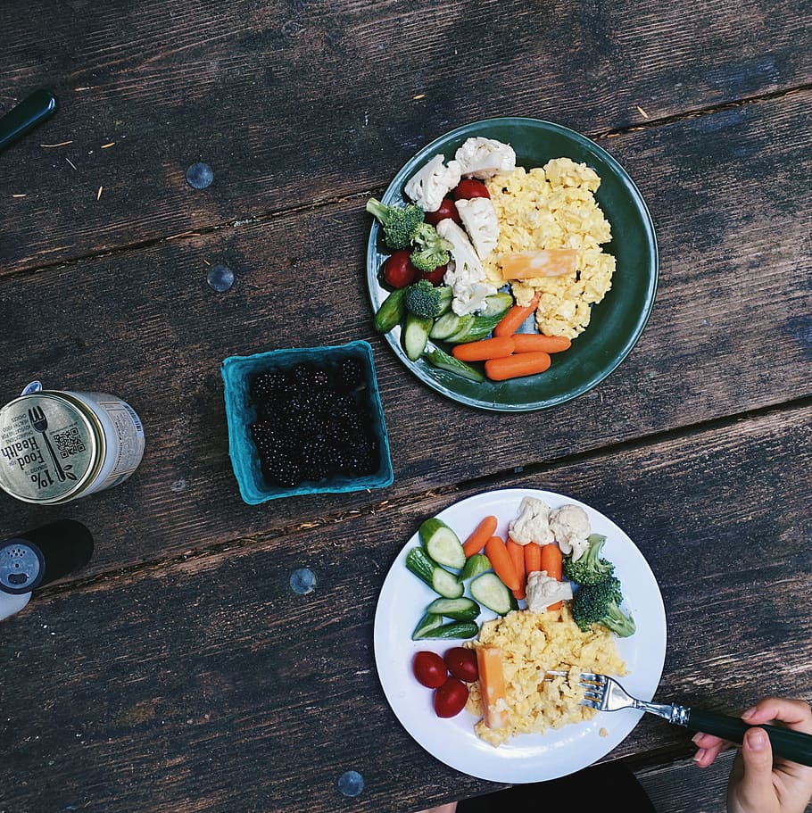 Healthy breakfast with eggs while camping, berries, broccoli HD wallpaper