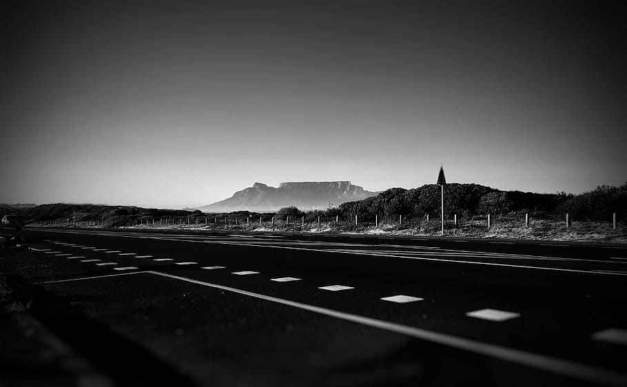 empty road in grayscale photography, concrete road beside forest HD wallpaper