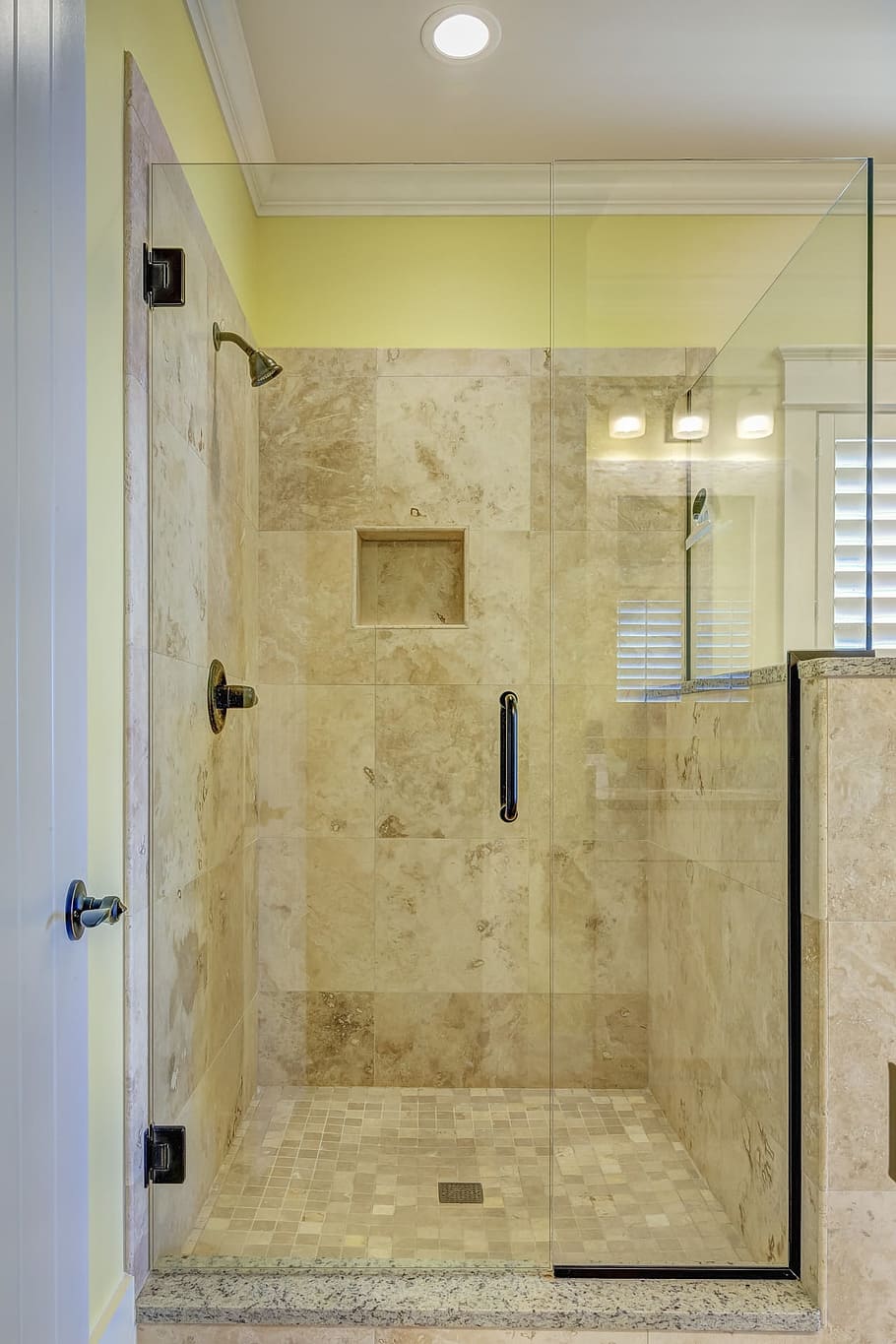 closeup photo of clear glass shower stall, tile, bathroom, interior