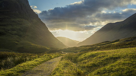 The light in Scottish Highlands, road near mountain during sunset HD wallpaper