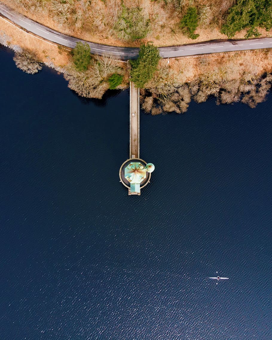 aerial view of dock on body of water beside island, aerial view of dock with body of water during daytime HD wallpaper