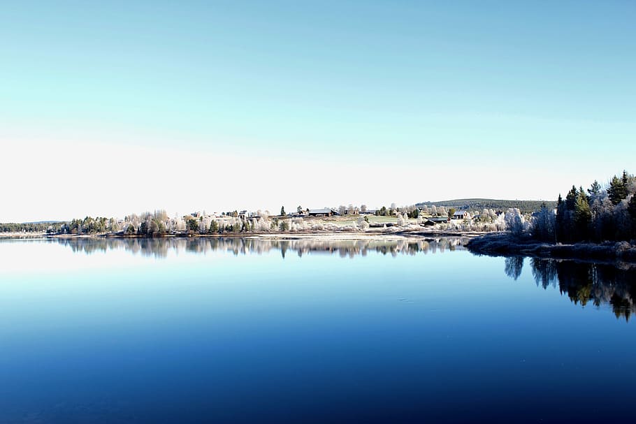 landscape photography of village surrounded with body of water, blue body of water HD wallpaper