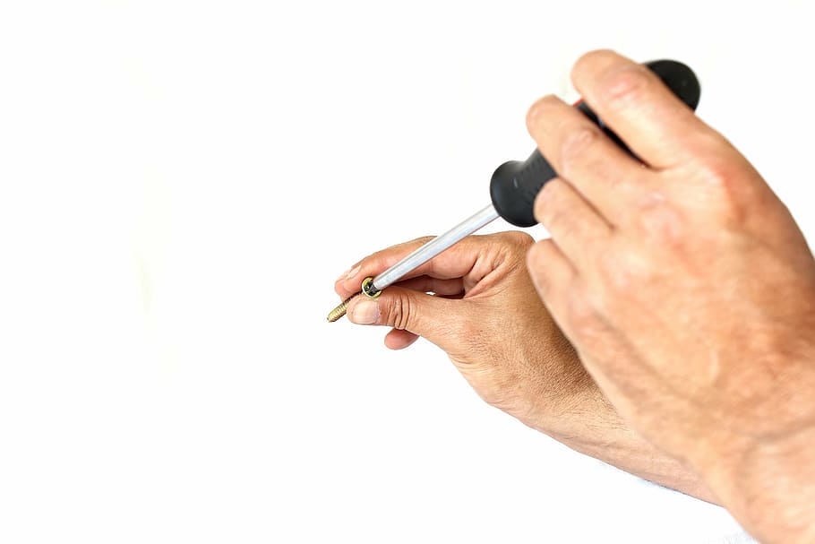 person holding screw and screwdriver, background, wooden, metal HD wallpaper