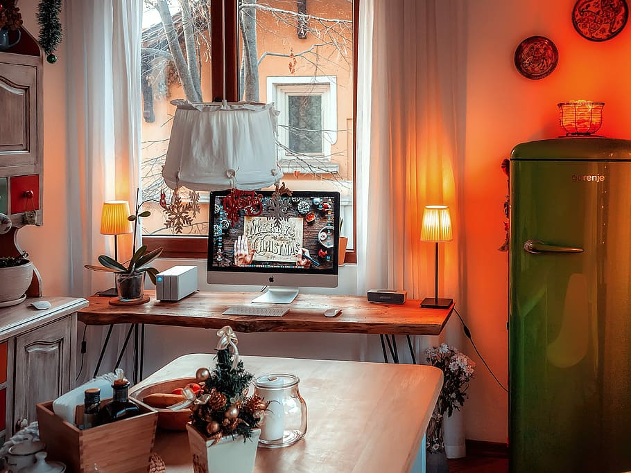 silver iMac turn on, wooden table near refrigerator inside kitchen HD wallpaper