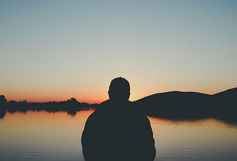 silhouette of man in front of beach during golden hour, person HD wallpaper