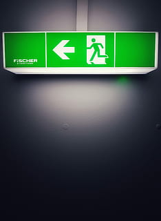 green road signage on wall, green Fischer fire exit signage, arror HD wallpaper