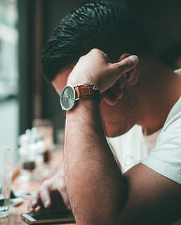 man using smartphone, man in white top resting his left arm, watch HD wallpaper
