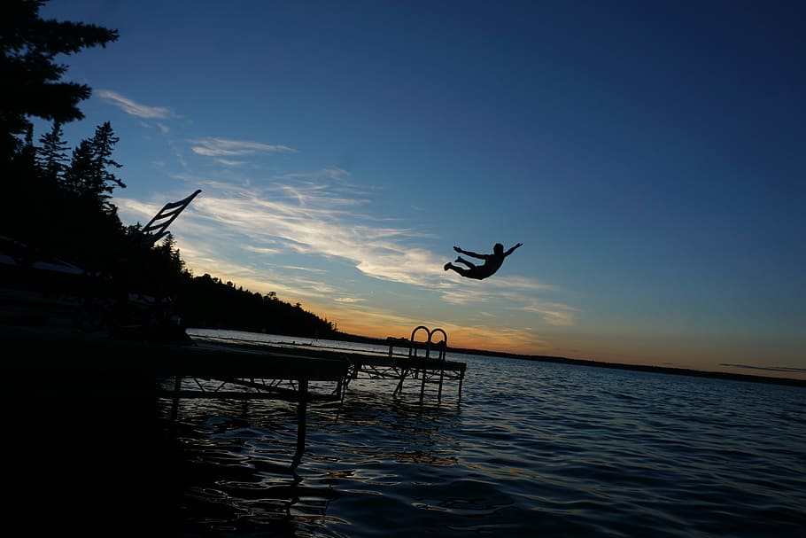 silhouette of person diving on water, person jumping on duck HD wallpaper