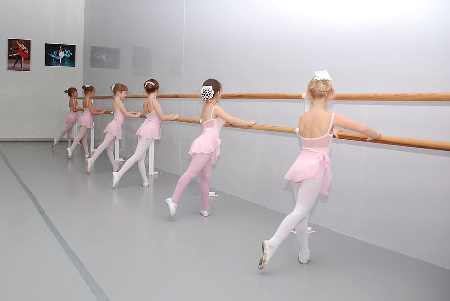 ballerinas holding wood rail, ballet, class, choreography, machine